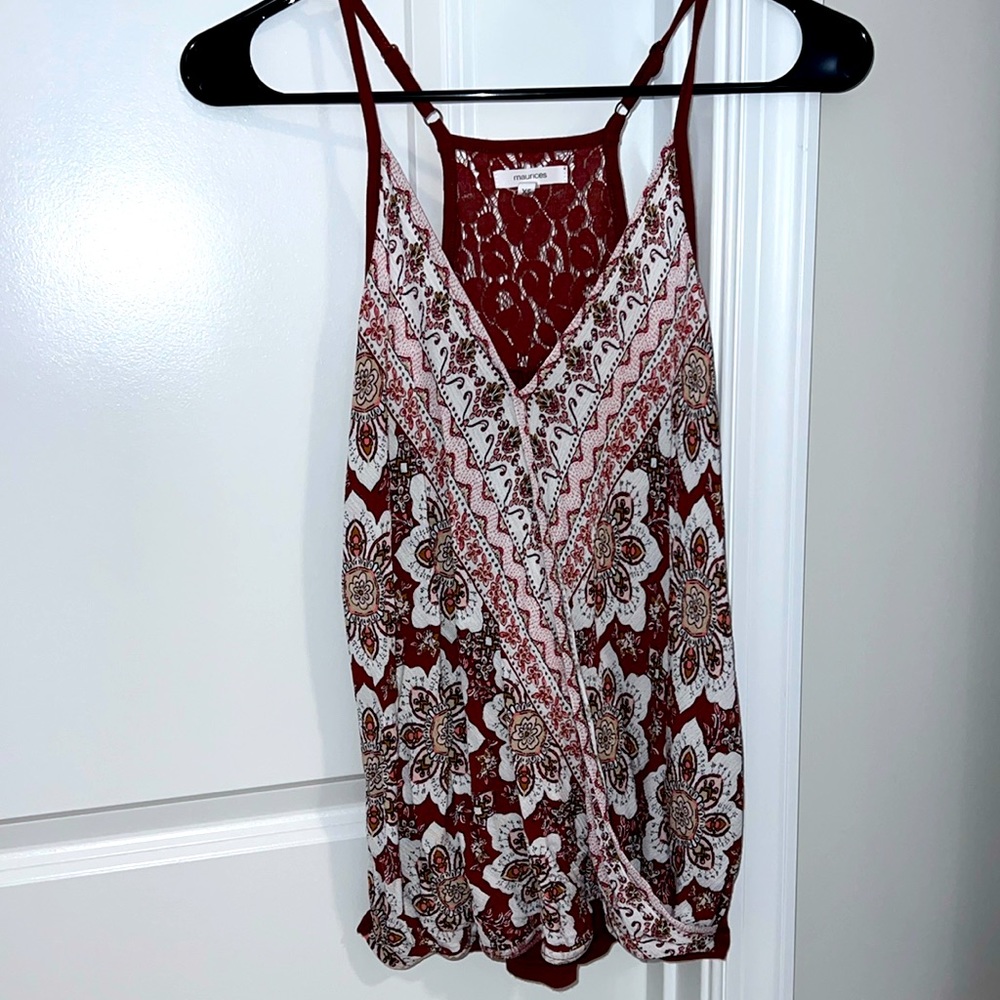 Criss cross flowy material in the front with lace halter backing. Rust color